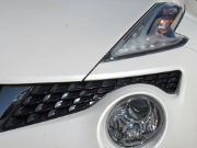 Nissan Juke, F15 A A12, 1.6 Liter Xtronic, Ansicht von vorne / Scheinwerfer links