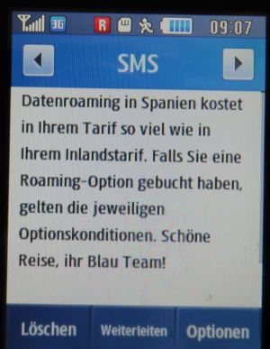 Blau, SMS auf einem Samsung GT–S3370 mit Meldung zum Datenroaming in Spanien