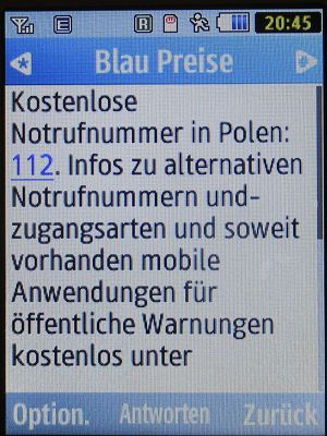 Blau, SMS auf einem Samsung GT–S3370 mit Meldung Notrufnummer in Polen Juli 2023