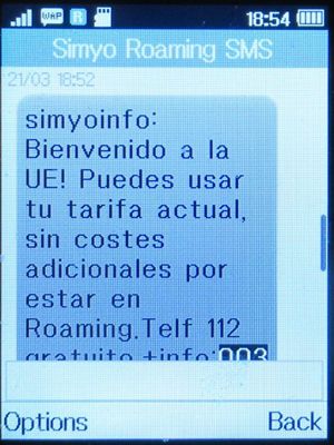 simyo prepaid SIM Karte Spanien, SMS Hinweis zum Roaming Tarif, Belgien im März 2023 auf einem Alcatel 2051X