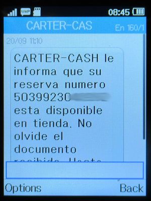 Carter-Cash, Alcalá de Henares, Spanien, Abholmitteilung per SMS auf einem Alcatel 2051X