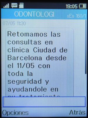 Clínica Odontológica de Postgrados Universitarios, Zahnarztpraxis, Madrid, Spanien, SMS Info Eröffnung Praxis auf einem Alcatel 2051X