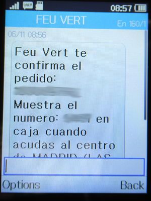 Feu Vert, Madrid, Spanien, Feu Vert SMS mit der Terminbestätigung auf einem Alcatel 2051X