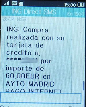 Kfz-Steuer, Madrid, Spanien, ING Direct SMS Zahlungsbestätigung auf einem Alcatel 2051X Mobiltelefon